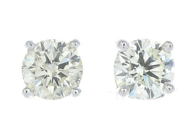 A pair of brilliant-cut diamond earrings.Estimated