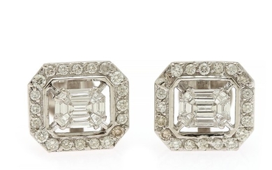 A pair of diamond ear studs each set with nine fancy-cut and numerous brilliant-cut diamonds, totalling app. 1.88 ct., mounted in 14k white gold. (2)