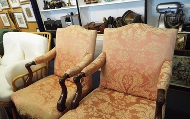 A pair of early 19thC French walnut antique armchairs having...
