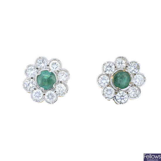 A pair of emerald and brilliant-cut diamond floral cluster earrings.