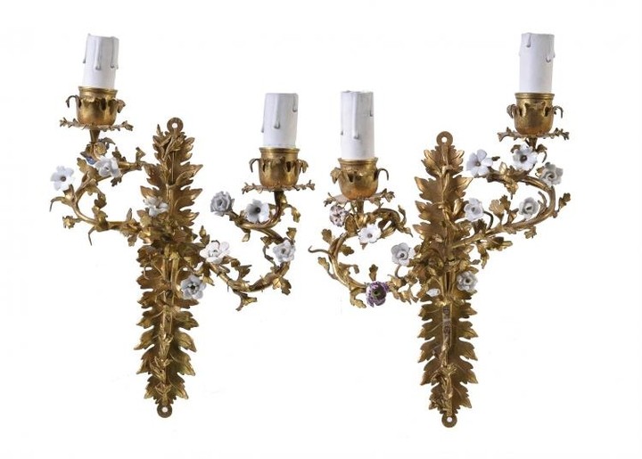 A pair of gilt metal and porcelain mounted twin light wall appliques in Louis XV style