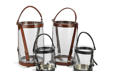 A pair of glass and brown leather candle holders