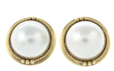 A pair of mabe pearl stud earrings.
