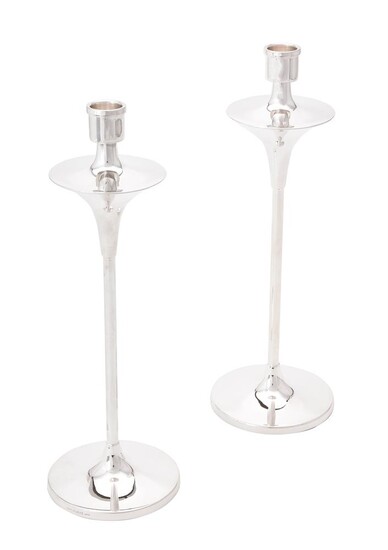 A pair of silver candlesticks by W. I. Broadway & Co.