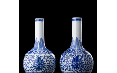 A pair of small blue and white bottle vases, apocryphal qianlong mark (restorations) China, late Qing dynasty/Republic Period (1912-1949) (h....