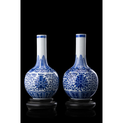 A pair of small blue and white bottle vases, apocryphal qianlong mark (restorations) China, late Qing dynasty/Republic Period (1912-1949) (h....