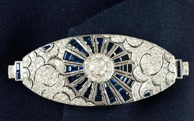 A sapphire and brilliant-cut diamond pierced geometric brooch.Estimated total diamond weight
