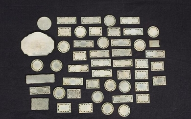 A set of carved mother of pearl gaming counters. China.