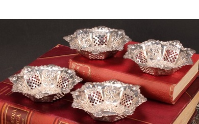 A set of four Victorian silver shaped circular sweetmeat dis...