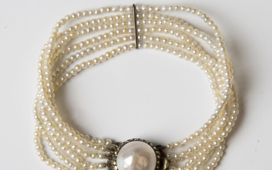 A six row bracelet of seed pearls on a cultured pearl and marcasite clasp, length 16.5cm, with an as