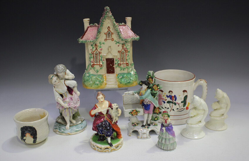 A small group of decorative ceramics, including a Bloor Derby figure of a woman and her dog, two Roy