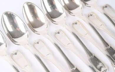 A suite of twelve teaspoons, the silver handle decorated with a slightly protruding band, a frieze of pearls and leafy staples.