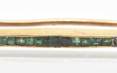 A yellow metal emerald and diamond set bar brooch, with...