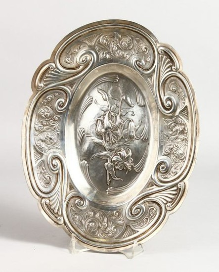AN ART NOUVEAU OVAL DISH with panels of flowers.
