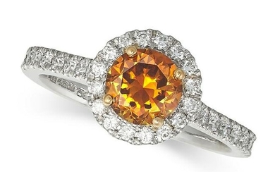 AN ORANGE DIAMOND CLUSTER RING in 18ct white gold and platinum, set with a round brilliant cut