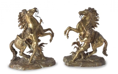 After Guillaume Coustou the Elder, (French 1677 - 1746), a pair of gilt bronze models of the Marly Horses, late 19th century