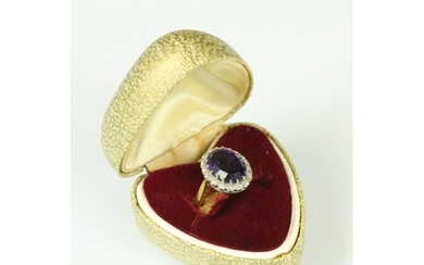 Amethyst and diamond dress ring having a large oval cut amet...