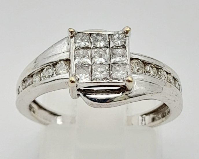 An 18K White Gold and Princess Cut Diamond Ring....