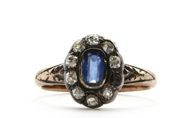 An 18ct gold sapphire and diamond cluster ring