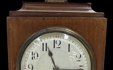 An Edwardian mahogany and inlaid mantel clock with white enamel...