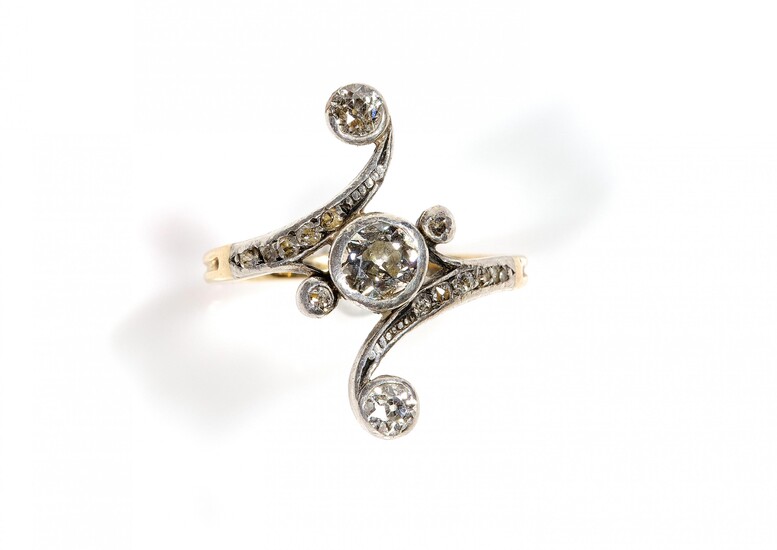 An antique 14k gold and silver diamond cross-over ring