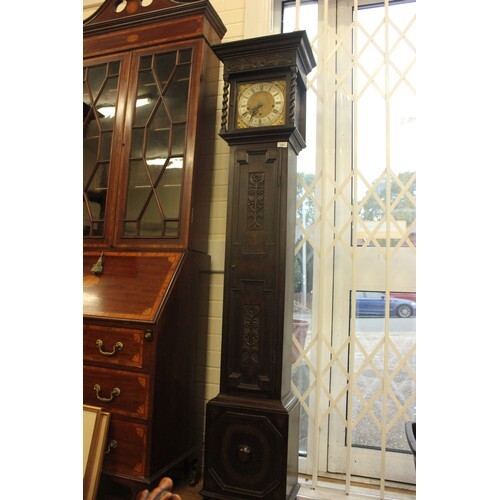 An early 20th century oak grandmother clock, with three trai...