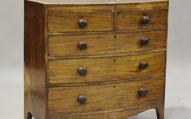 An early Victorian mahogany and satinwood crossbanded bowfront chest of two short and three long dra