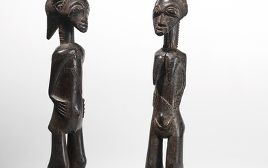 An early pair of Baule asie usu (meaning 'genius of the bush') figures, used by diviners.