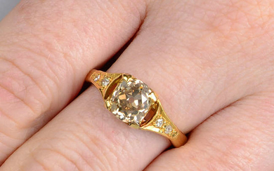 An old-cut brown diamond single-stone ring, with diamond shoulders.