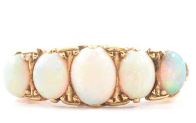 An opal half hoop ring.