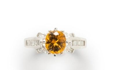 An orange sapphire, diamond and eighteen karat white