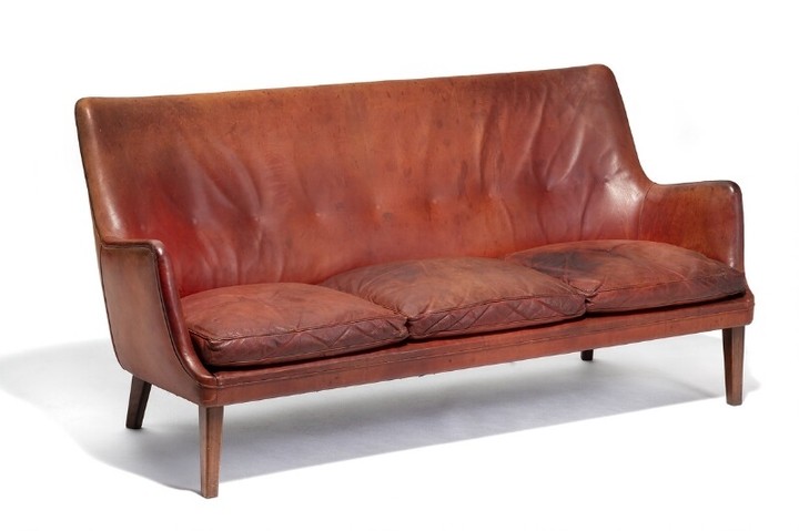 Arne Vodder: Freestanding three seater sofa with tapering Brazilian rosewood legs. Upholstered with patinated cognac coloured leather.