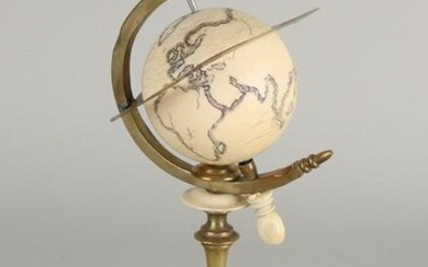 Brass with bone globe. 20th century. Size: 18 cm. In