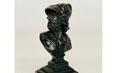 Bronze SUBJECT with brown patina representing a helmet...