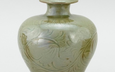 CHINESE CELADON STONEWARE VASE In inverted pear form, with an incised floral design. Height 7.25".