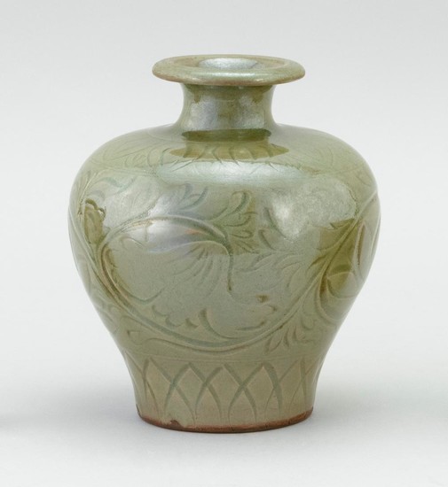 CHINESE CELADON STONEWARE VASE In inverted pear form, with an incised floral design. Height 7.25".