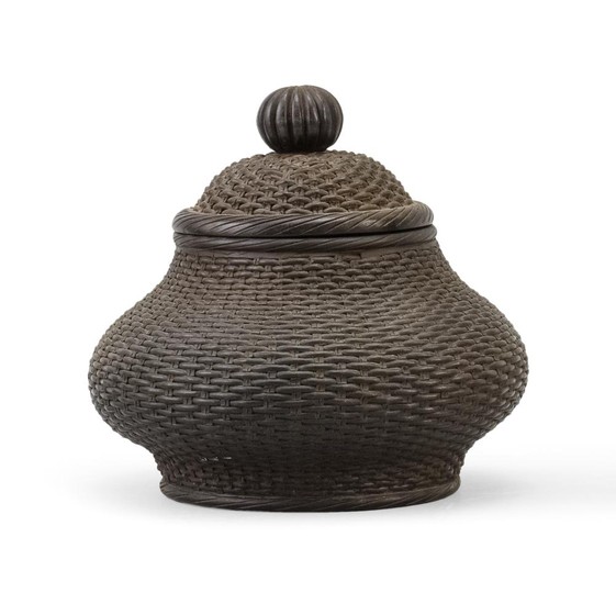 CHINESE YIXING POTTERY JAR In pear shape, with basketry design. Two marks beneath cover and seal mark on base. Height 6".