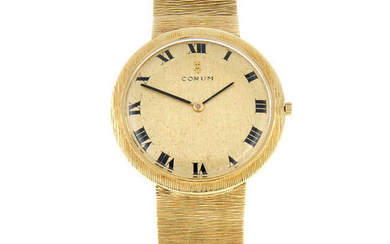 CORUM - an 18ct yellow gold bracelet watch, 34mm.