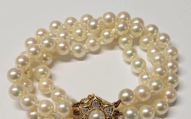 CULTURED PEARL TRIPLE STRAND BRACELET WITH 18CT GOLD PEARL &...