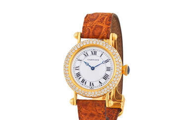 Cartier. A fine 18K gold manual wind wristwatch with diamond...