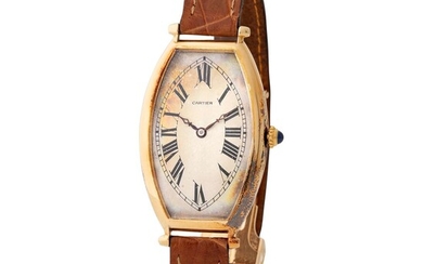 Cartier. Very Rare Tonneau-Shape Wristwatch in Yellow Gold, With Silver Roman Numbers Dial and Certificate from Cartier
