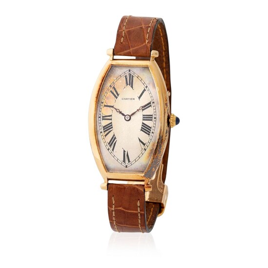Cartier. Very Rare Tonneau-Shape Wristwatch in Yellow Gold, With Silver Roman Numbers Dial and Certificate from Cartier