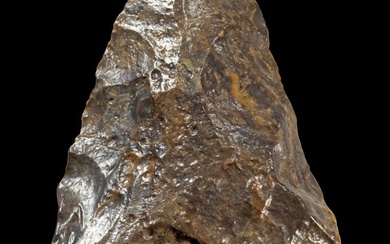 Coin de poing. Paléolithique, Afrique du Nord, env. 1.000.000 - 200.000 av. J.-C. L 13,5cm....