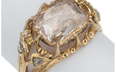 Diamond, Gold Ring The ring features a cushion-shaped rose-cut...