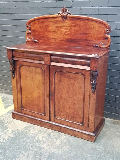 Early Victorian Mahogany Chiffonier, with carved back, two cushion shaped drawers & two arched panel doors (H:150 W:120 D:46cm)