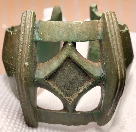 Early medieval Bronze Massive Openwork Bracelet with a Central part shaped as a Rhombic stylization of a Cross.