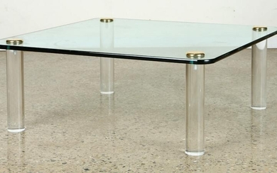 GLASS TOP COFFEE TABLE W/ ADJUSTABLE LUCITE LEGS