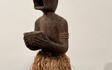 Ivory Coast, Baule, a standing monkey ritual figure, mbra, ca. mid 20th century;