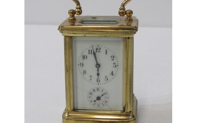 MINIATURE BRASS CARRIAGE CLOCK with white enamel face and se...