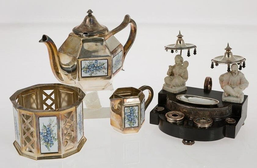 Metal teapot, milk pot and centrepiece
